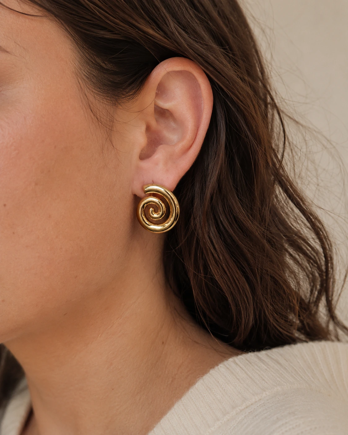 Sculptural Spiral Stud Earrings styled on ear