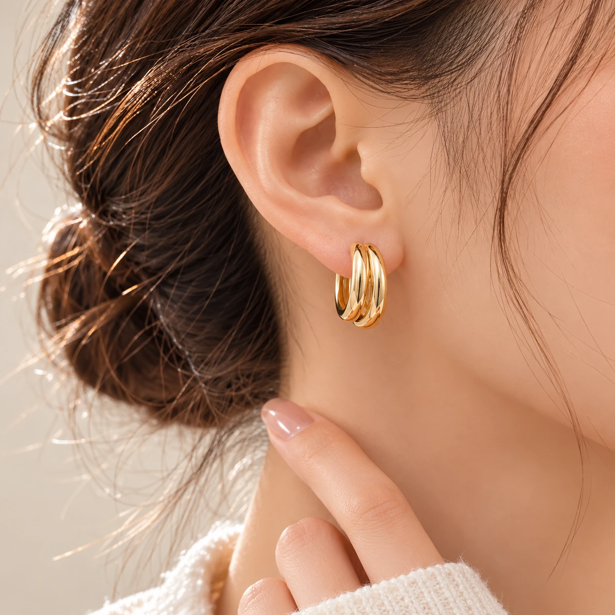 Triple Curve Hoop Earrings styled on ear